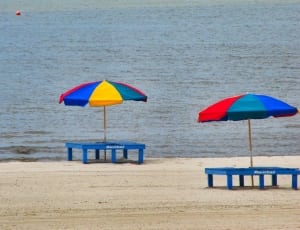 two beach chairs and parasols thumbnail