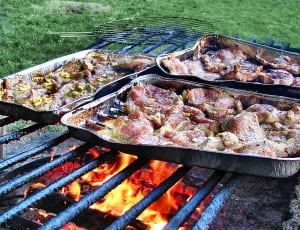 three assorted meat dishes on charcoal grill thumbnail
