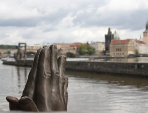 grey concrete hand statue thumbnail