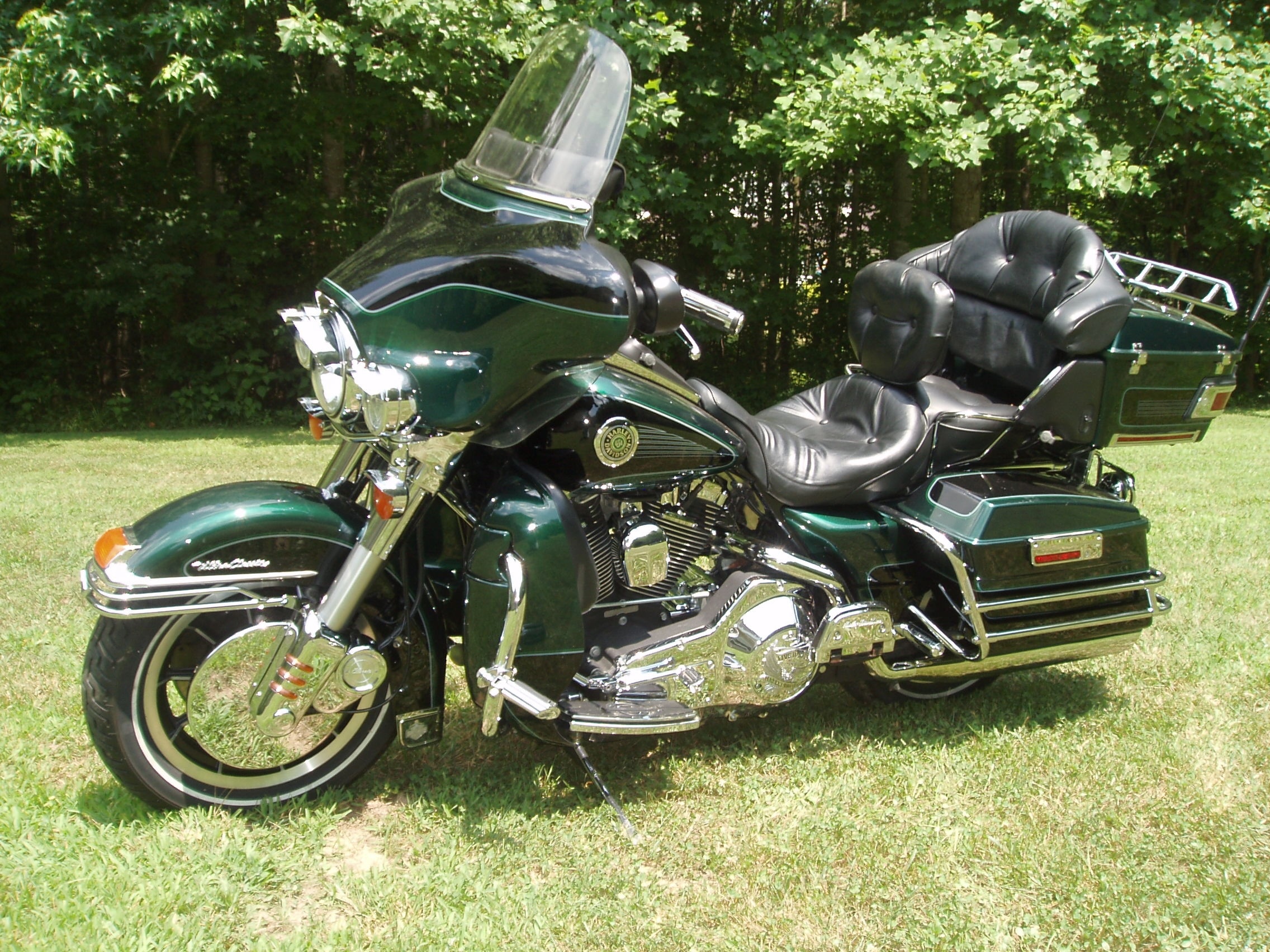 green and black touring motorcycle