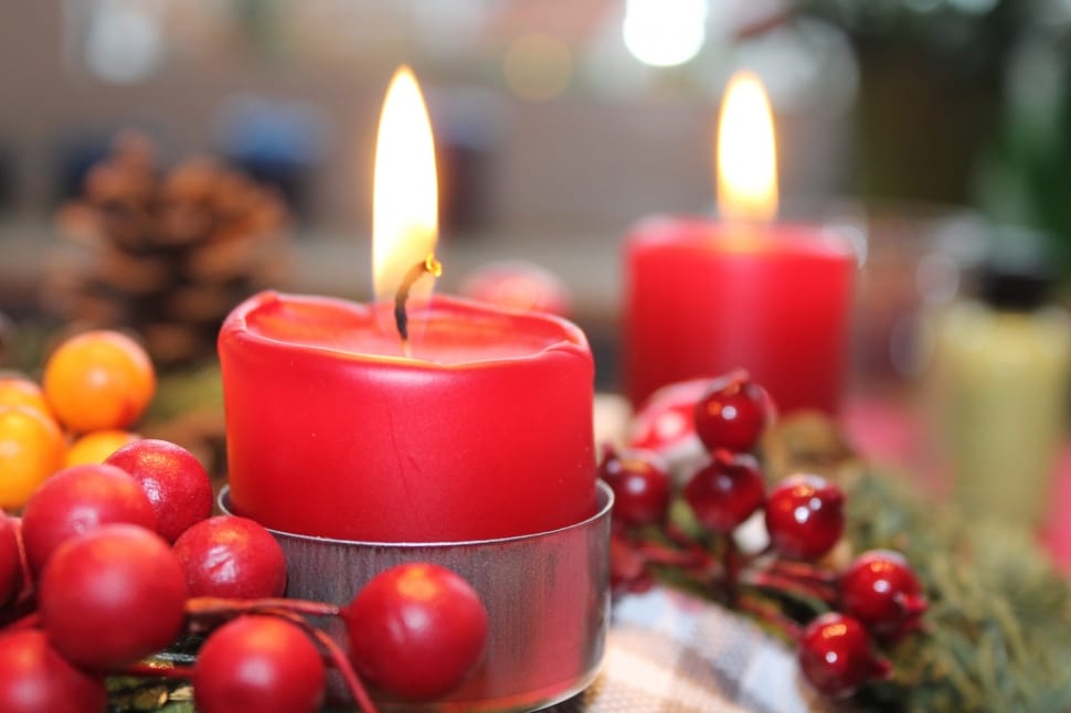 two lighted red candles preview