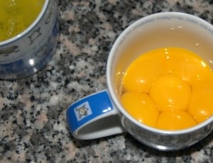 egg yolk on white ceramic mug thumbnail