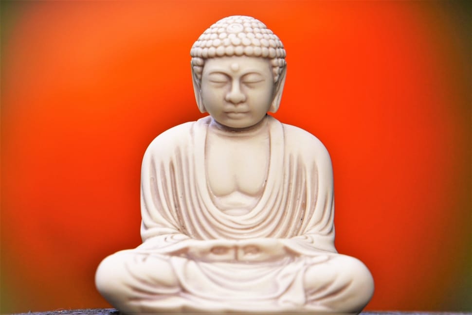 white sitting buddha figurine preview