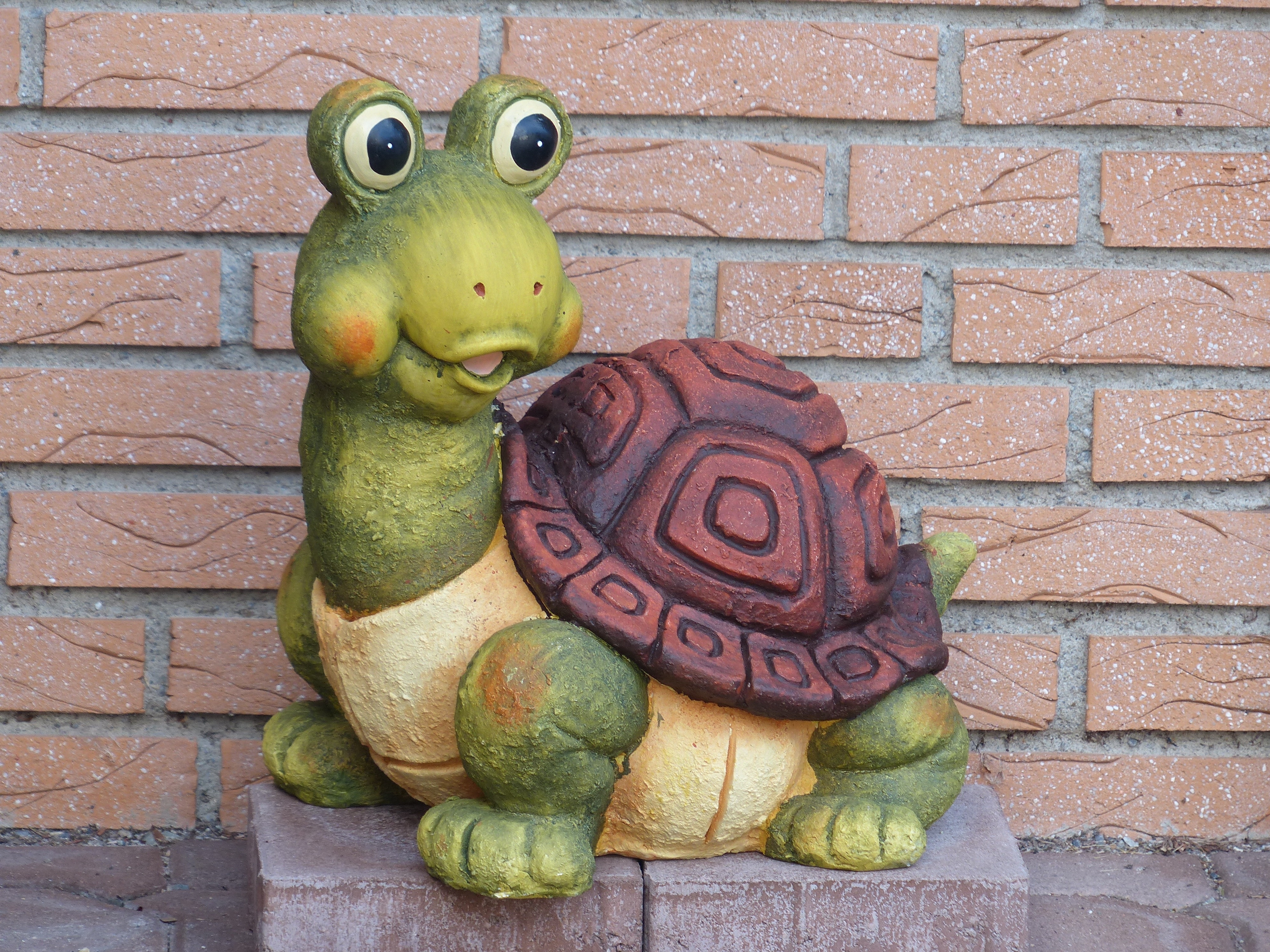 green and brown turtle ceramic figurine