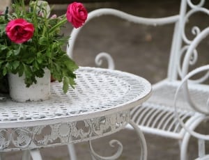white round metal coffee table an red rose thumbnail
