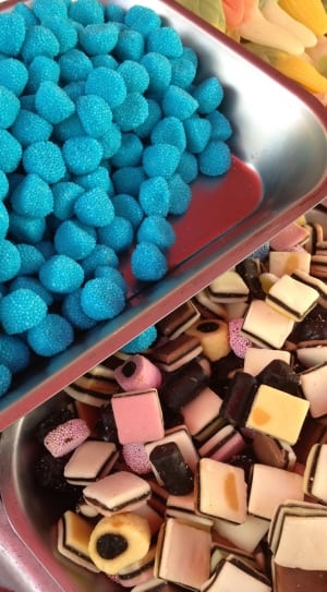 Assorted candies in stainless steel  rectangular trays thumbnail