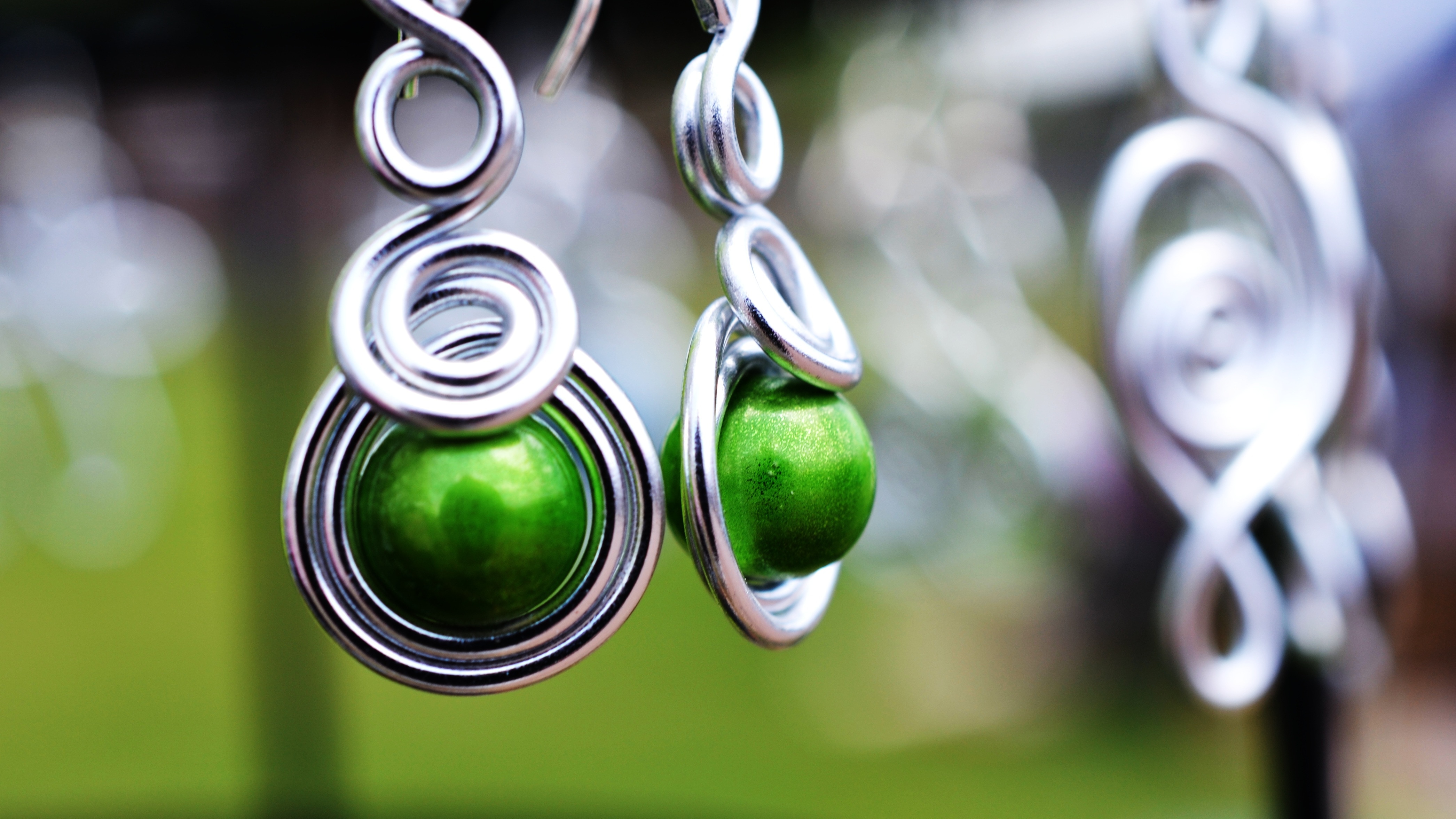 women's silver framed green bead accessory