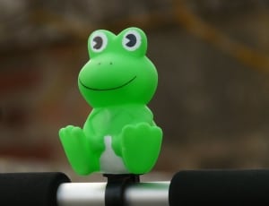 green and white frog plastic toy thumbnail