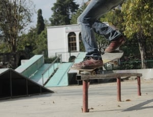 low angle photograph of a skateboard player on trail thumbnail