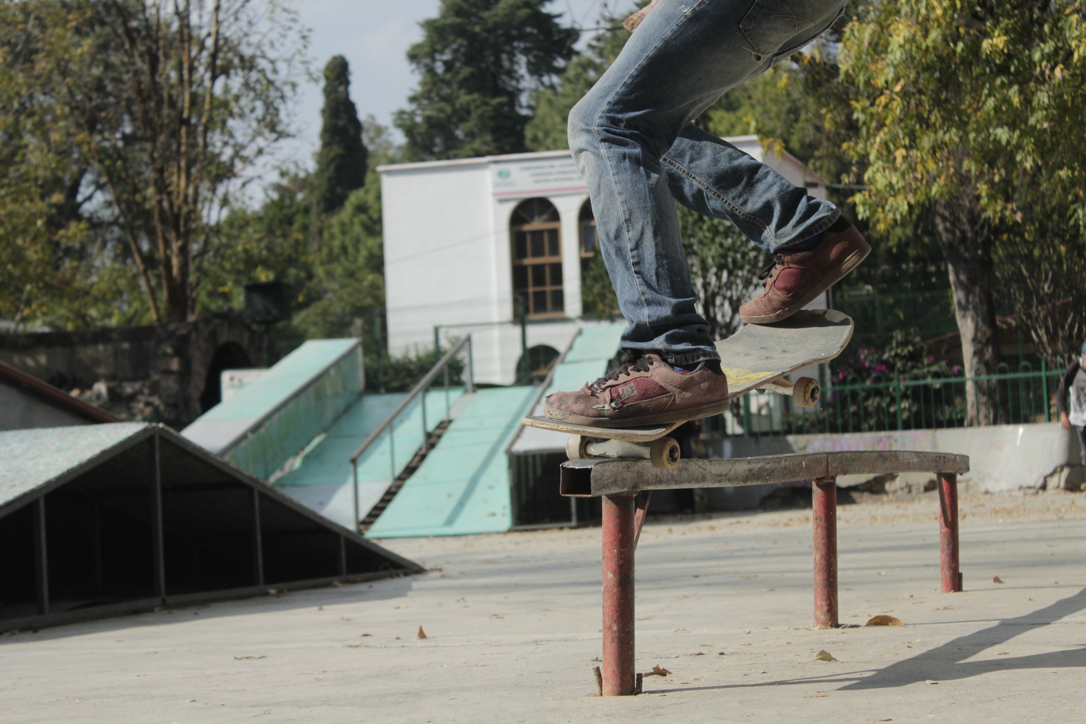 low angle photograph of a skateboard player on trail