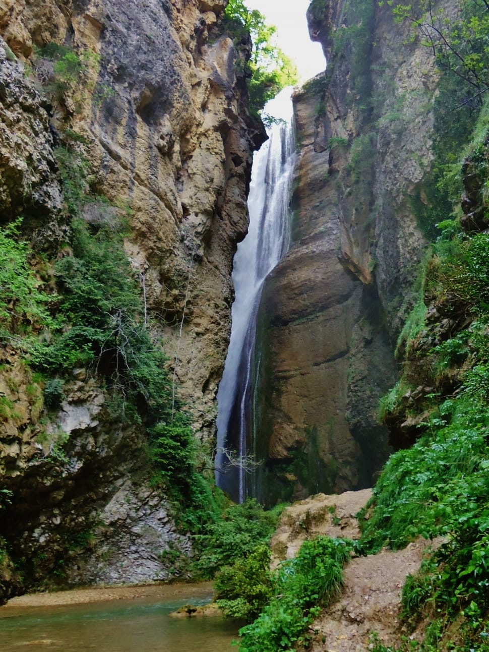 landscape painting of waterfalls between rocks preview