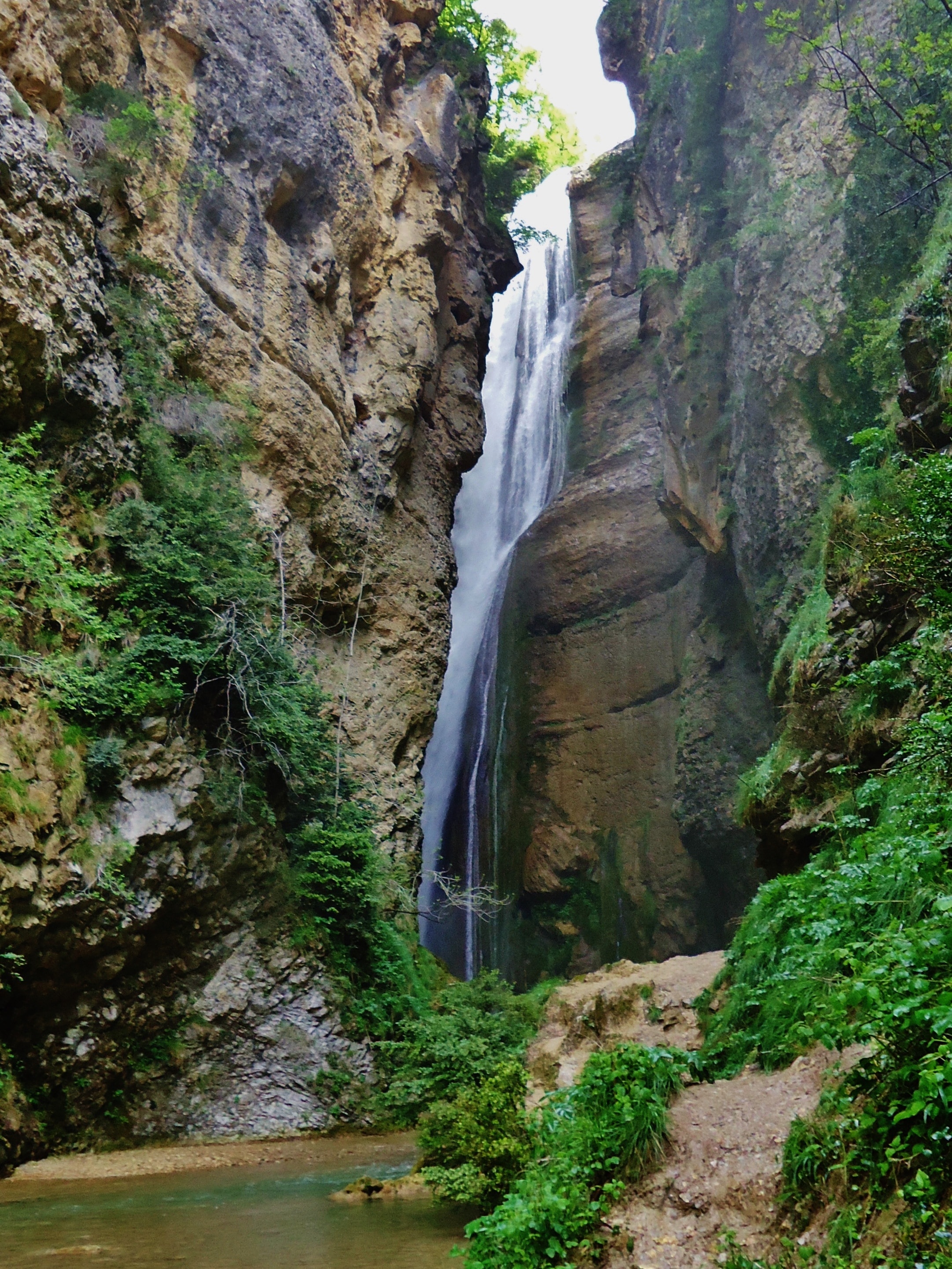 landscape painting of waterfalls between rocks