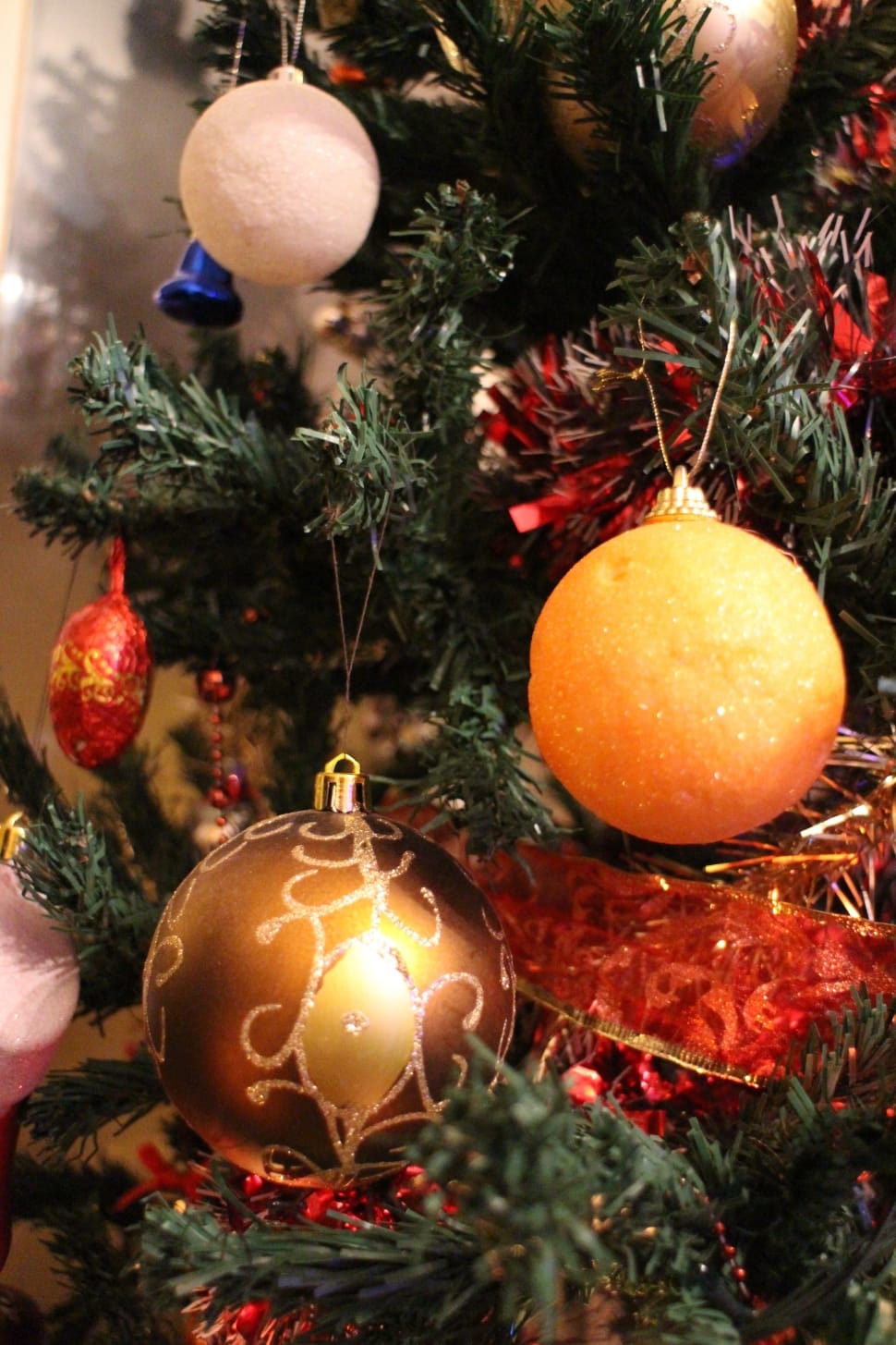 christmas baubles on christmas tree indoors preview