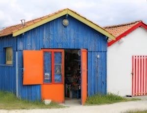 blue and orange wooden house thumbnail