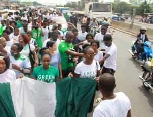 white and green nigeria flag and group of peoples thumbnail