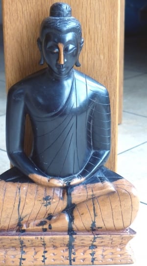 black and brown wooden buddha carving thumbnail