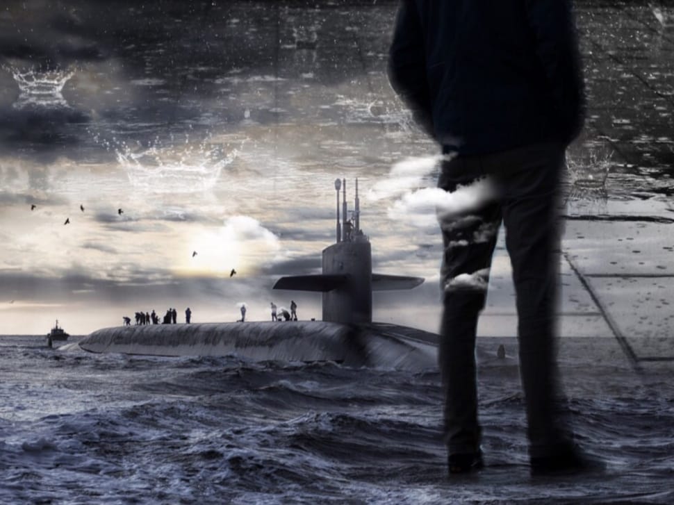 man's silhouette and submarine submerged in water preview