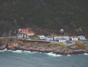 houses near sea during daytime thumbnail