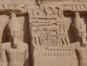 engraved hieroglyphics and statues thumbnail