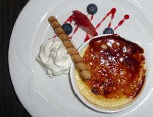 desert with blueberry strawberry sauce and white whip cream thumbnail