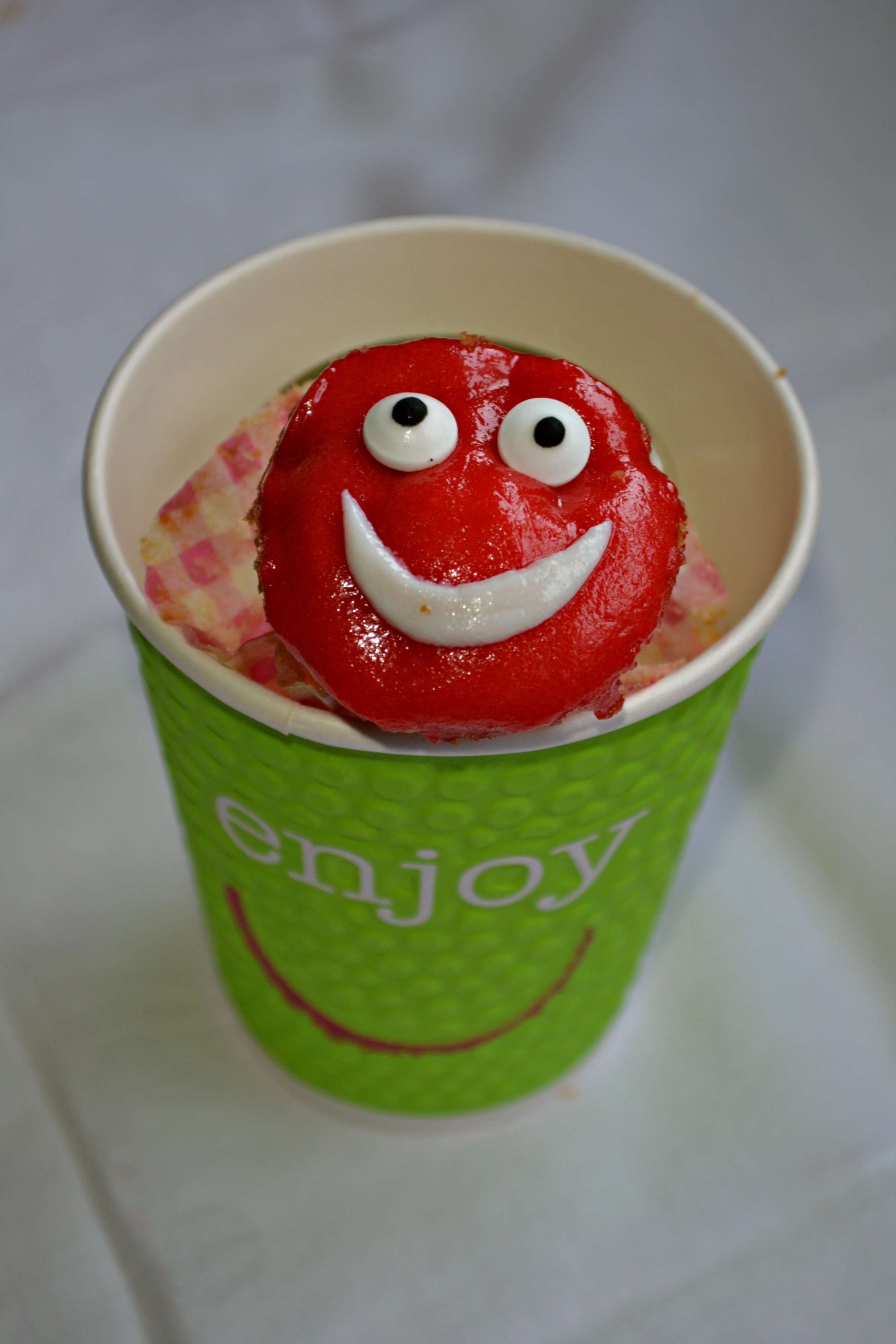 red and white smiley emoticon cupcake