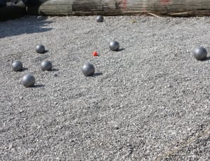7 metal sport ball on ground during daytime thumbnail