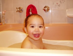 toddler in white bath tub thumbnail