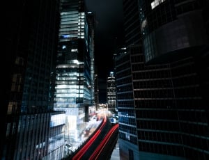 time lapse photography of lighted buildings at night thumbnail