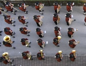 marching bands playing instruments on street thumbnail