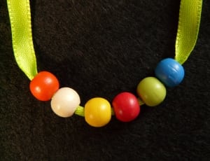 green red blue and white beaded necklace thumbnail