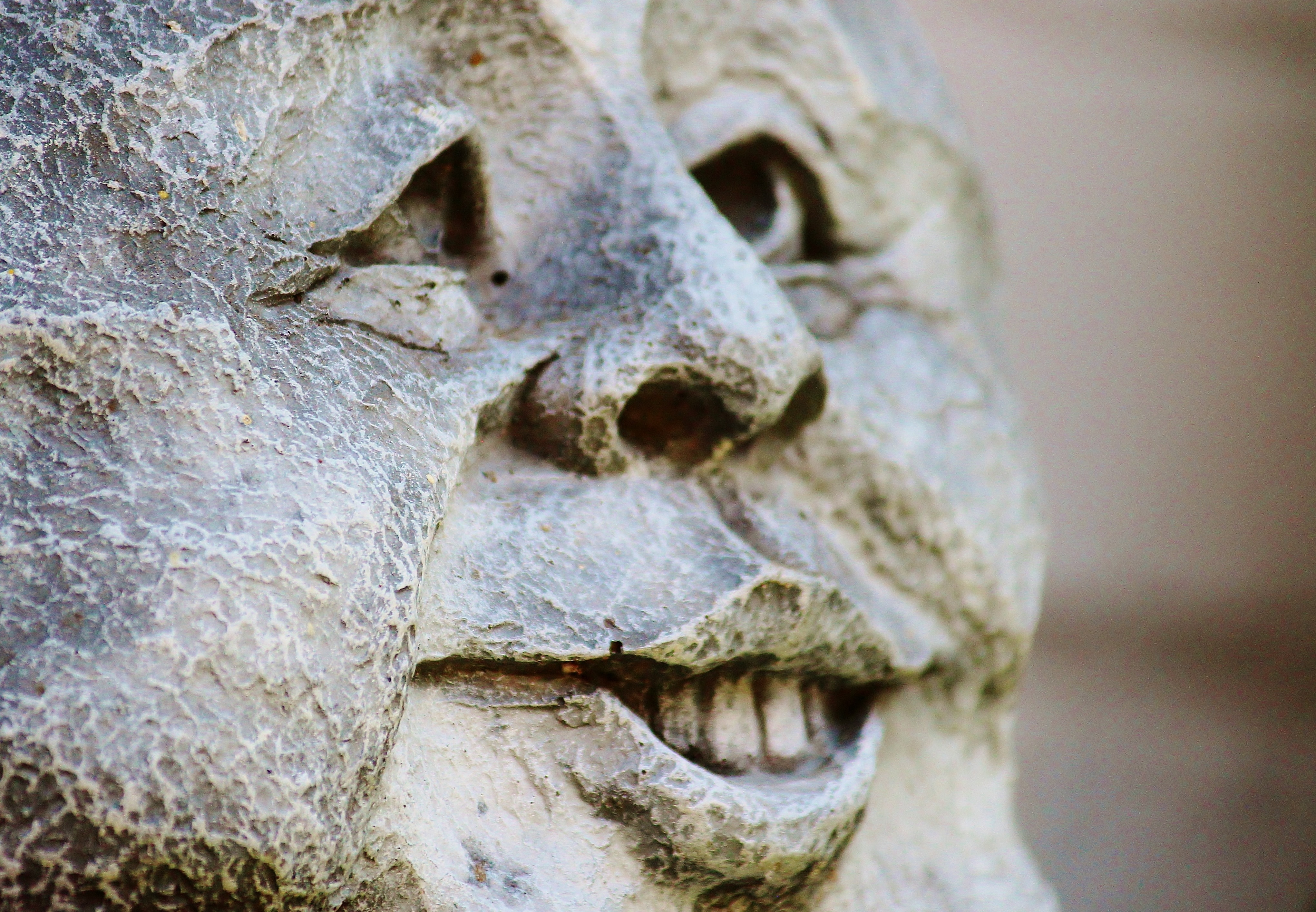 man smiling statue during daytime