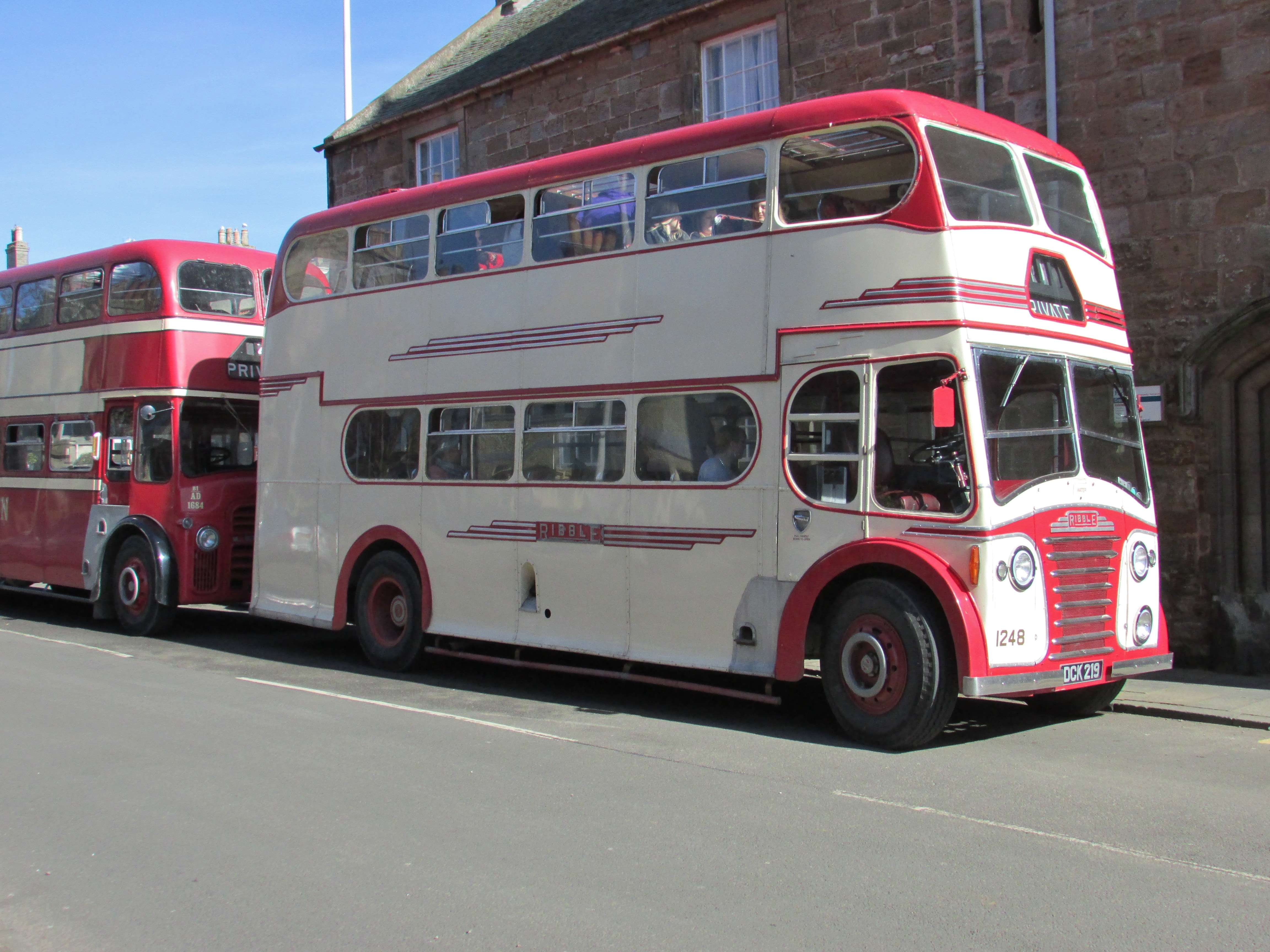 white red two deck bus