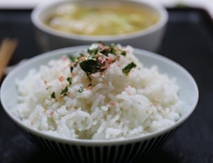 cook rice with on white ceramic bowl thumbnail