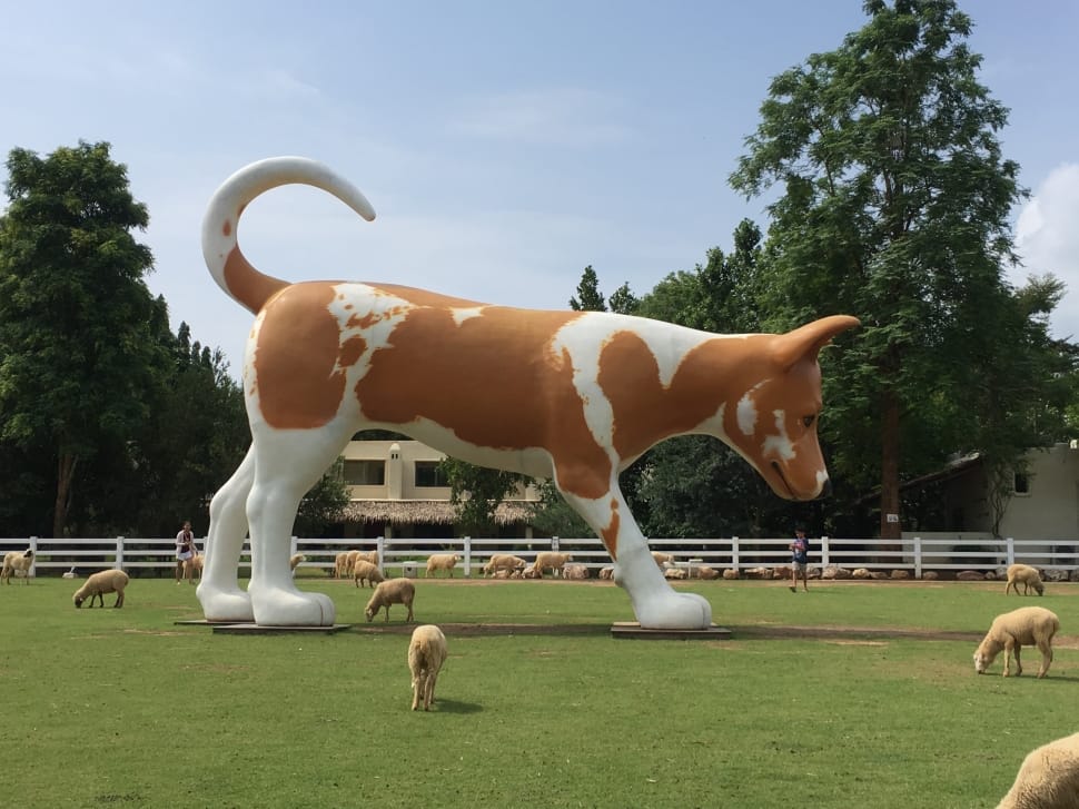 white and brown dog concrete statue preview
