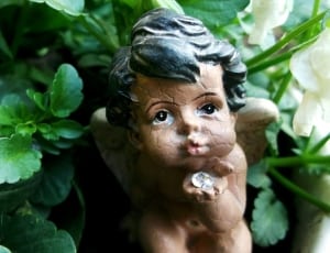 brown black decor figurine cherub thumbnail