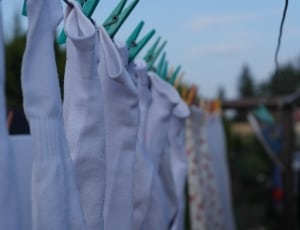white foot sock lot hanging on clothes pin thumbnail