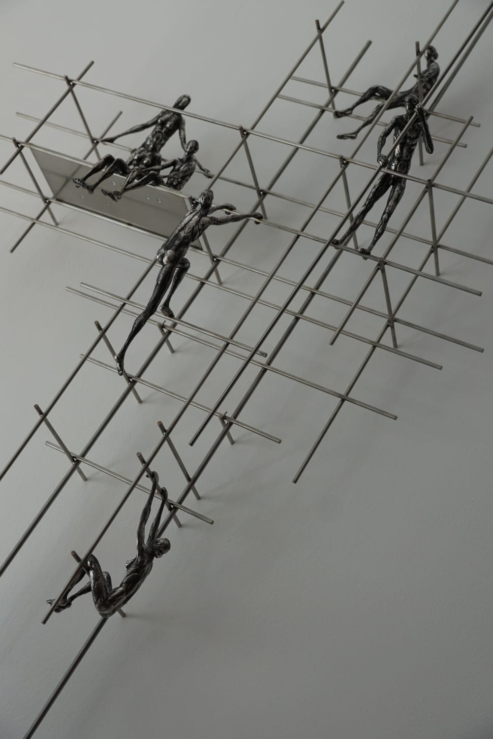 6 person climbing on frame metal figurines preview