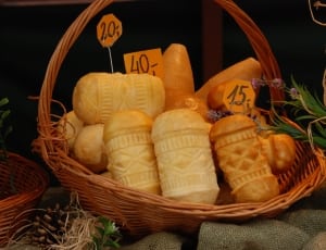 white and brown figurines and brown wicker basket thumbnail