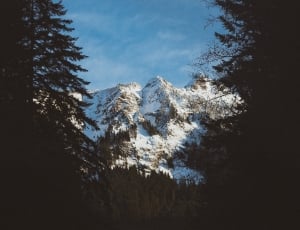 mountain covered in snow during daytime thumbnail