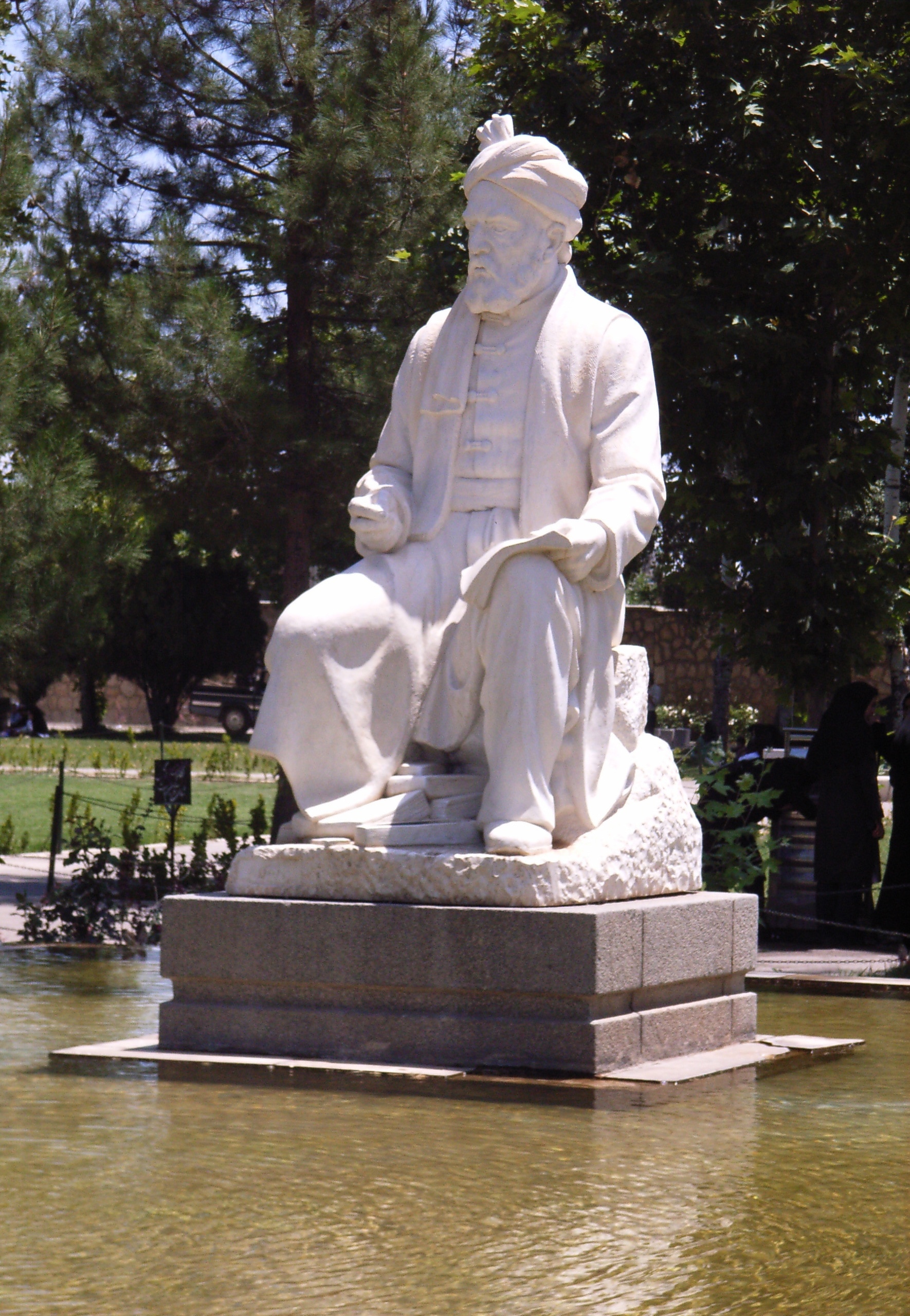 man sitting concrete statue
