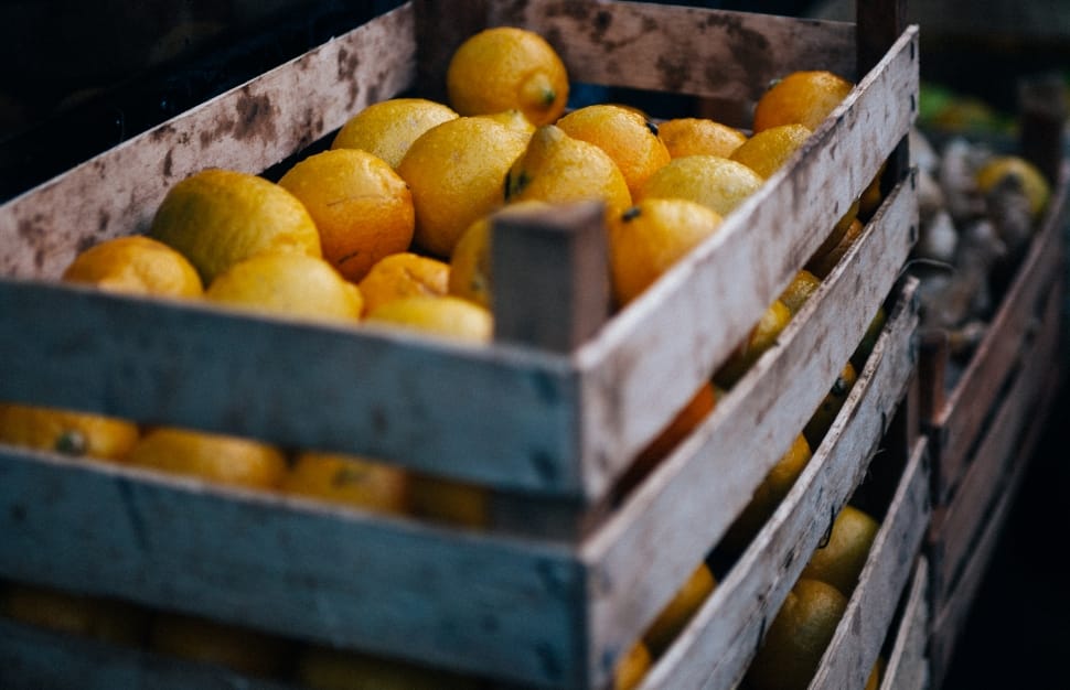 yellow lemon lot in brown wooden crate shallow focus photography preview