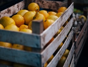 yellow lemon lot in brown wooden crate shallow focus photography thumbnail