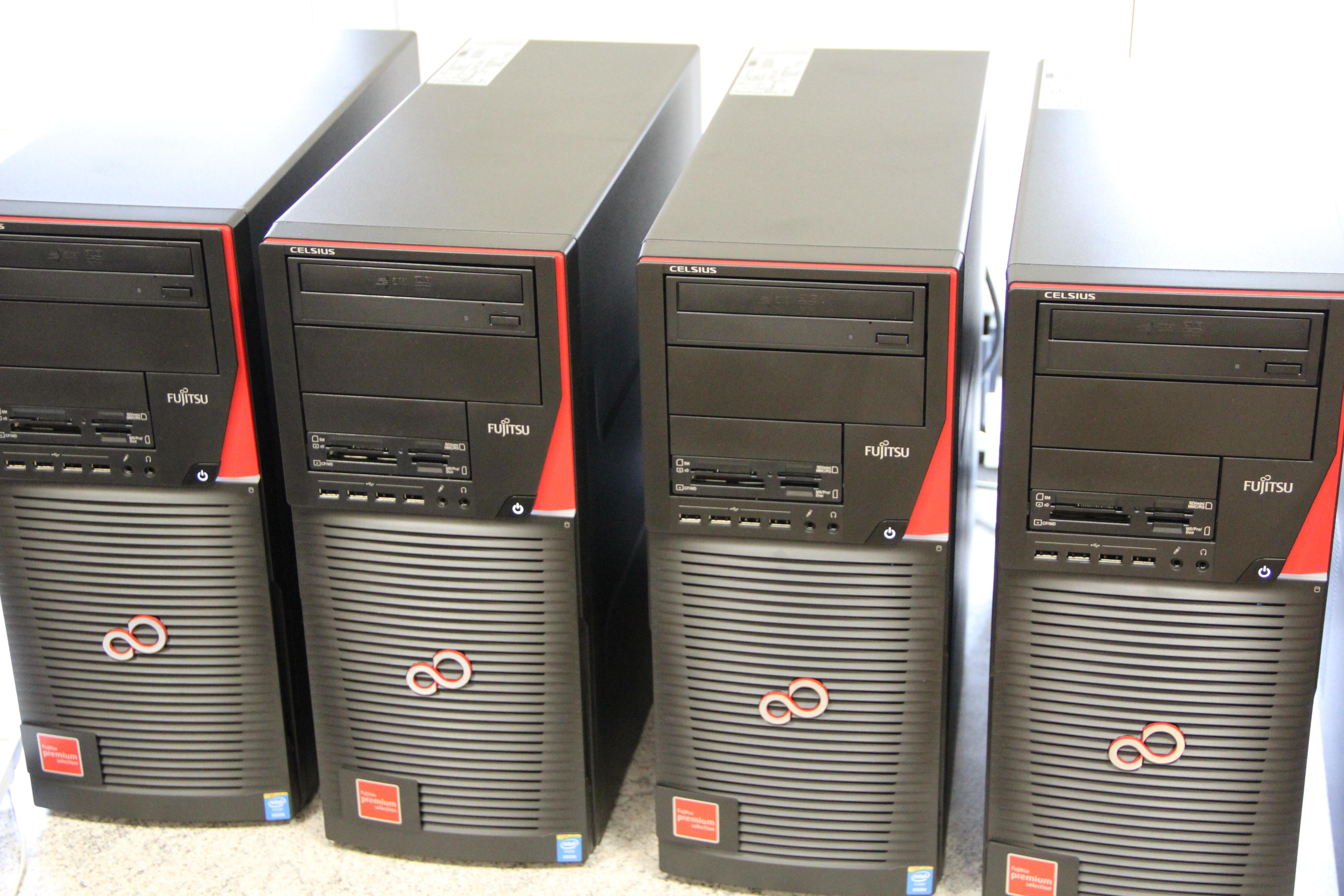 4 black and red computer towers