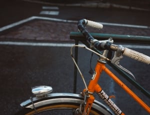 orange and black cruiser bicycle thumbnail