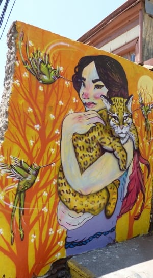 woman holding leopard painting thumbnail