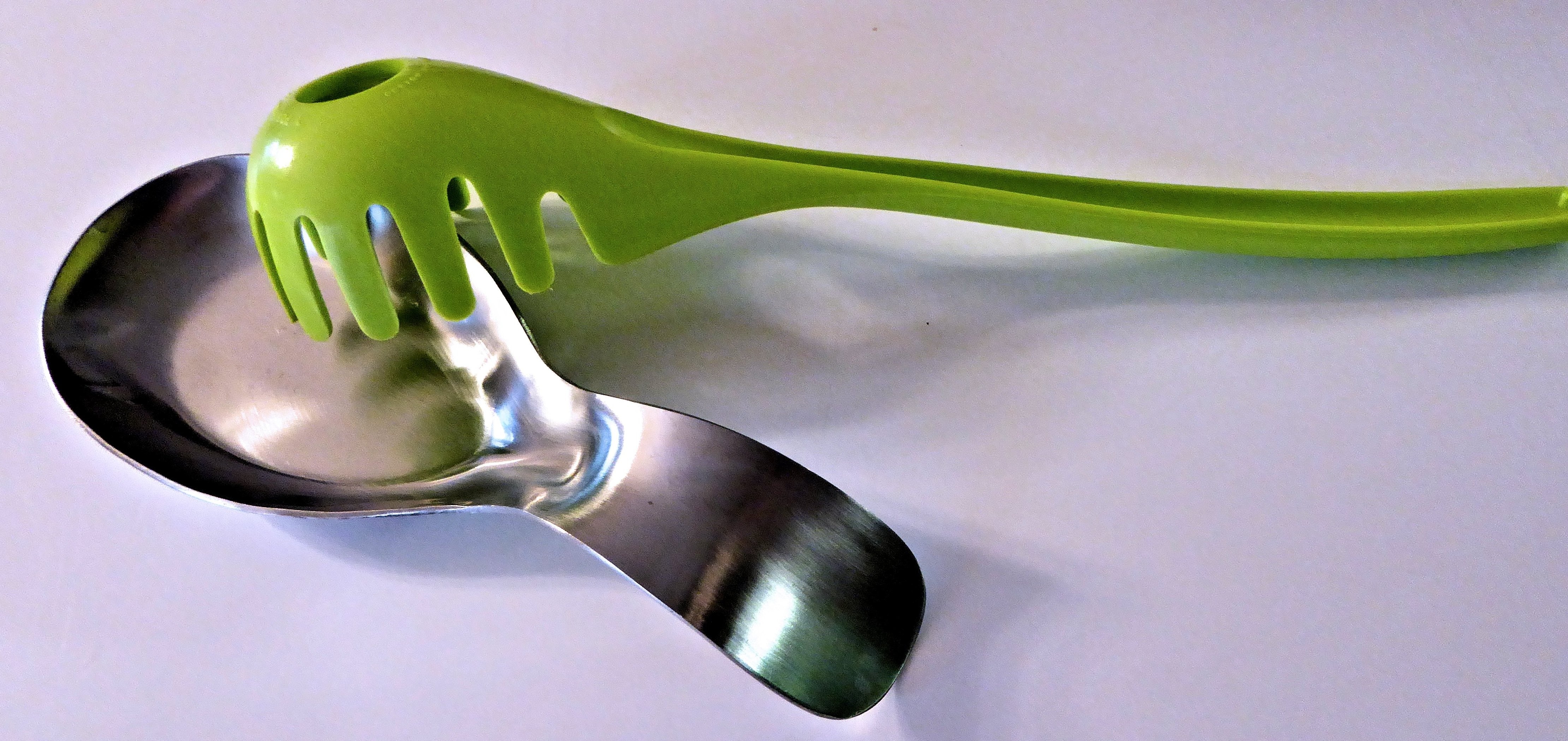 silver scoop and green plastic ladle