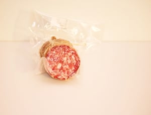 red cylinder meat inside clear plastic pack thumbnail