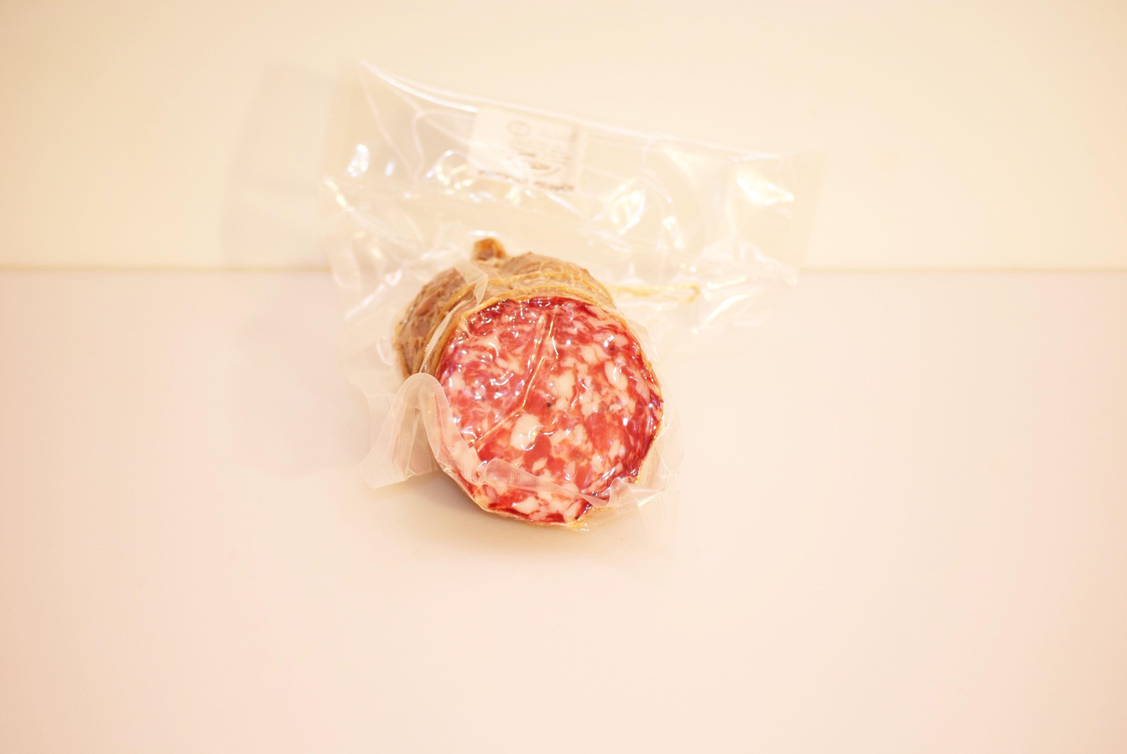 red cylinder meat inside clear plastic pack
