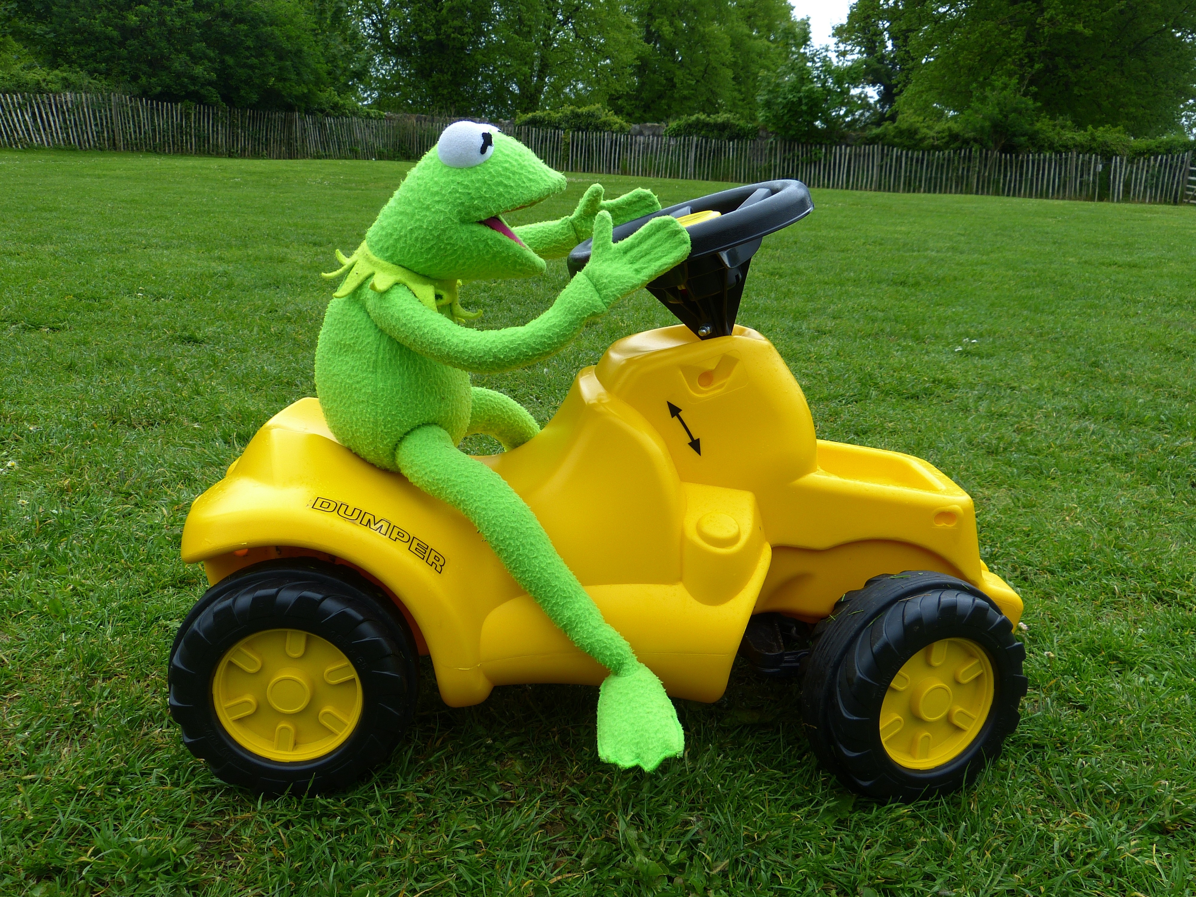 hermit the frog plush toy and yellow ride on toy