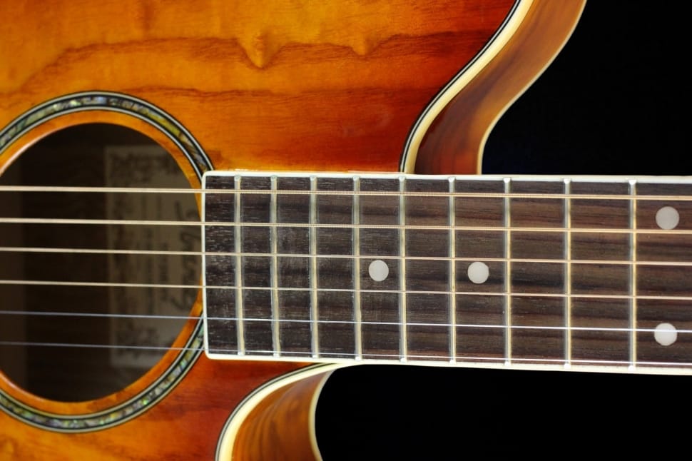 brown 6-string guitar closeup photo preview